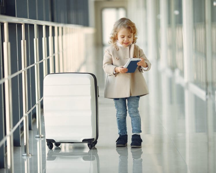 child-with-luggage-at-airport